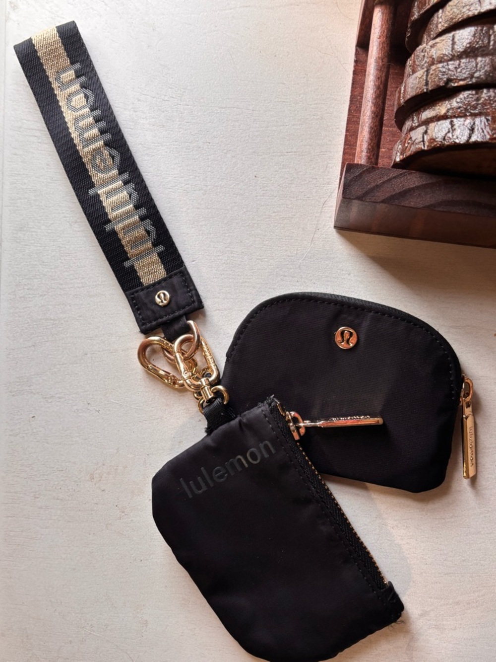 lululemon athletica Black and Gold Logo Wrist Strap